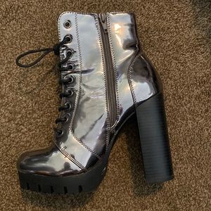 Silver Chrome 4 inch heels. Size 6. Worn once